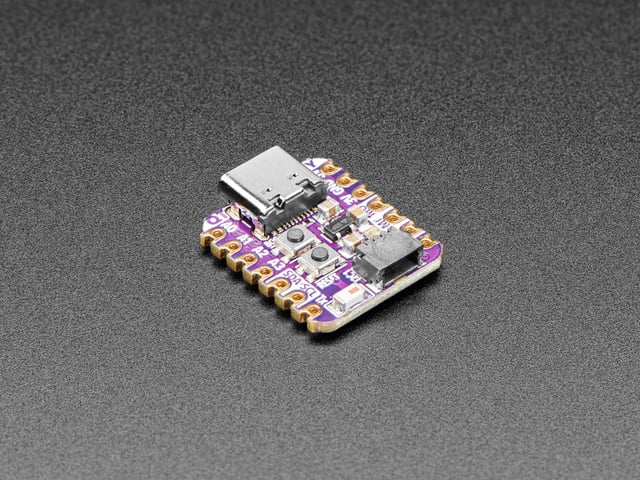 Angled shot of small square purple dev board.