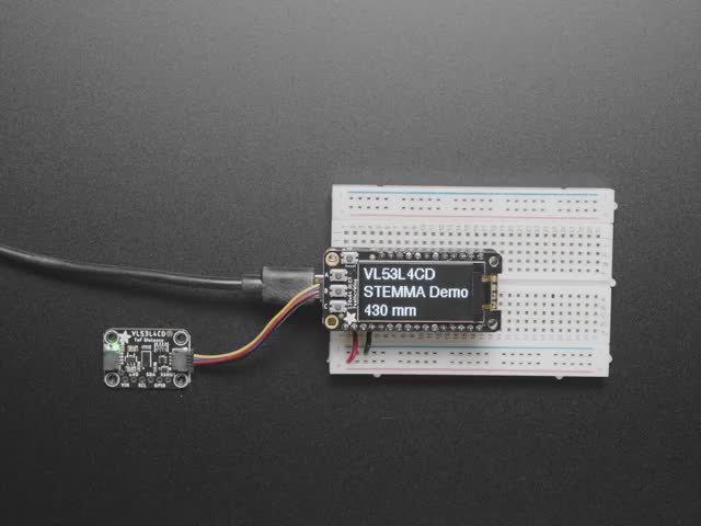 Video of a hand hovering over a Adafruit VL53L4CD Time of Flight Distance Sensor thats connected to a white breadboard reading the range of motion of the hand. 