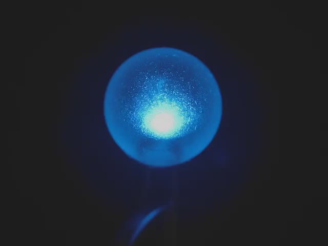 Video of a sphere-shaped LED emitting blue light.