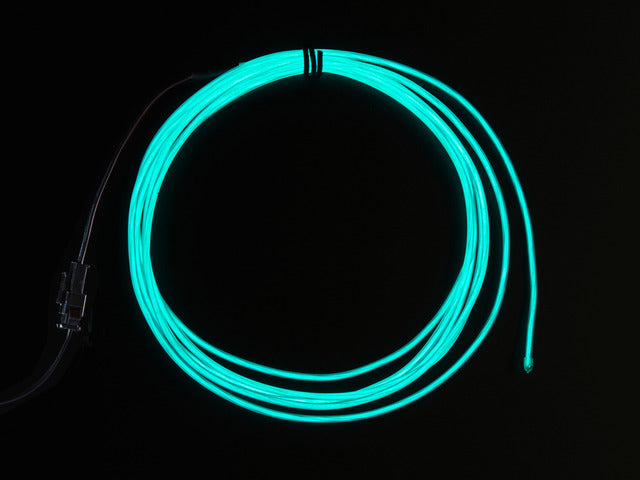 Coil of lit EL wire in aqua blue