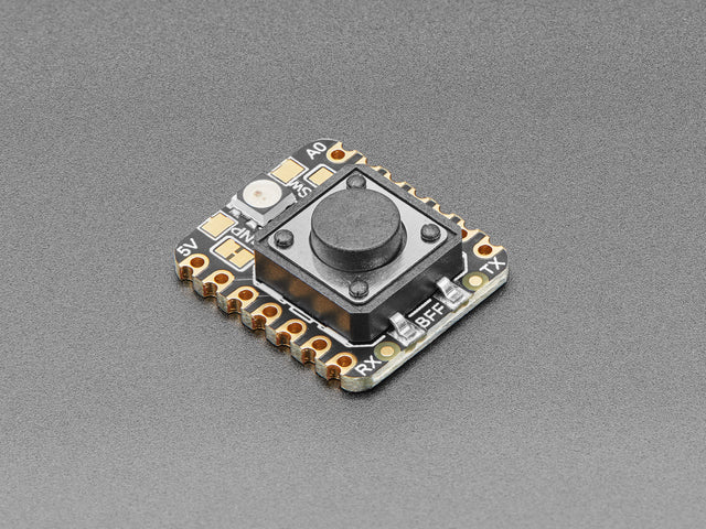 Angled shot of a square-shaped breakout board with an on-off button.