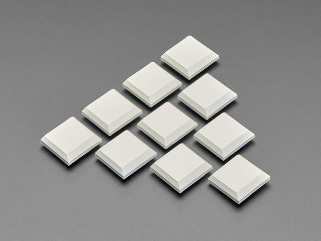 Angled shot of ten milky CHOC keycaps.