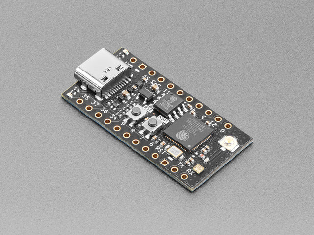 Angled shot of short rectangular black microcontroller.