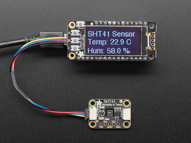  temperature sensor breakout connected to an OLD screen, which displays the ambient temperature and humidity.