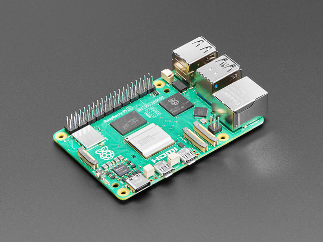 Angled shot of green Raspberry Pi microcontroller.