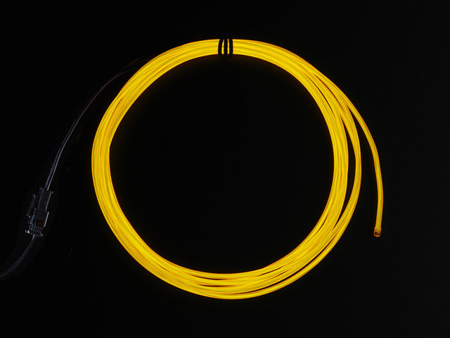 Coil of lit EL wire in yellow