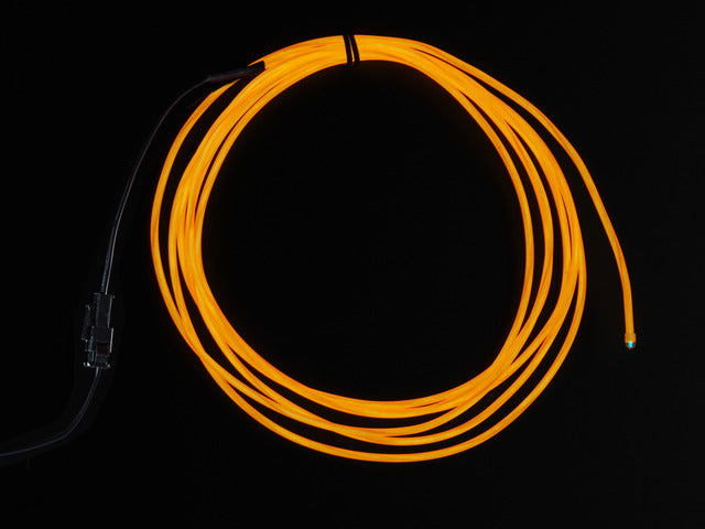 Coil of lit EL wire in orange