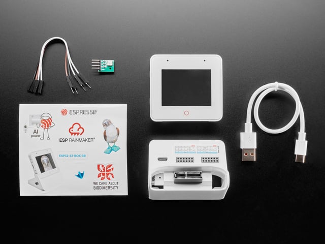 Overhead shot of electronics kit for white, square-shaped IoT display device.