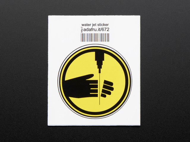 Circular sticker showing left hand with fingers severed by water pick, in black on yellow background, with black edge.  Mounted on white paper with barcode